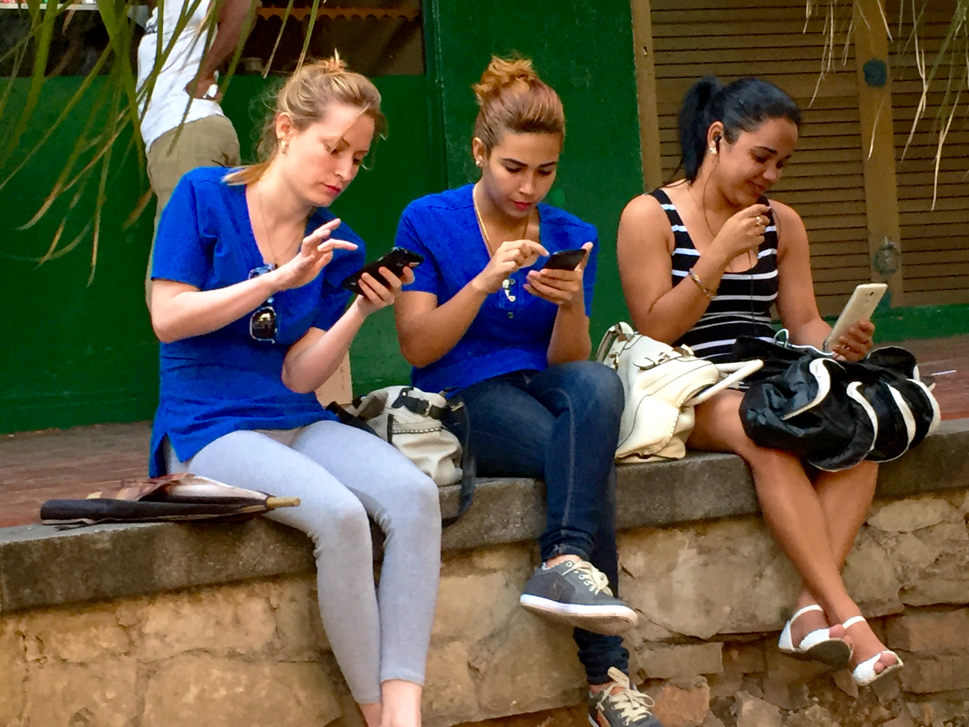 Cubans using wifi hotspot